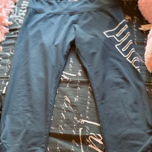 black Puma leggings with “puma” logo on the side .